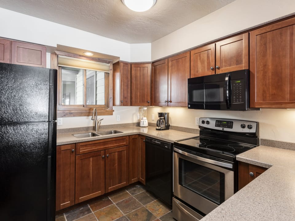Tiled floor and wood cabinets in the kitchen