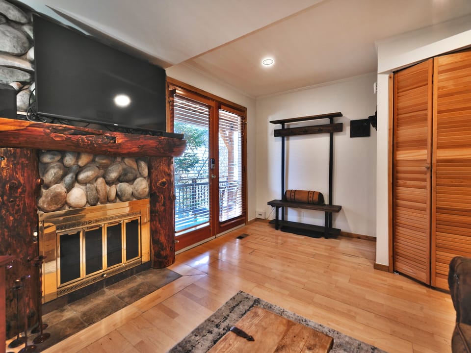 Front room with cabinet hiding the private washer/dryer