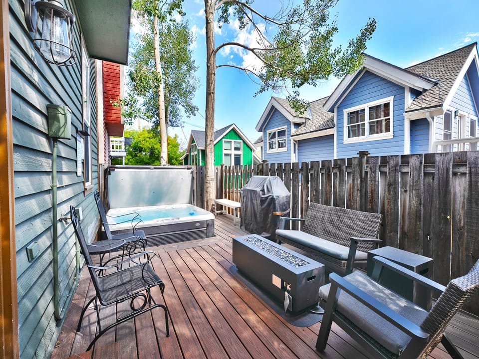 Your patio sanctuary right in the heart of old town, wooden deck with wooden privacy fence, hot tub and patio seating