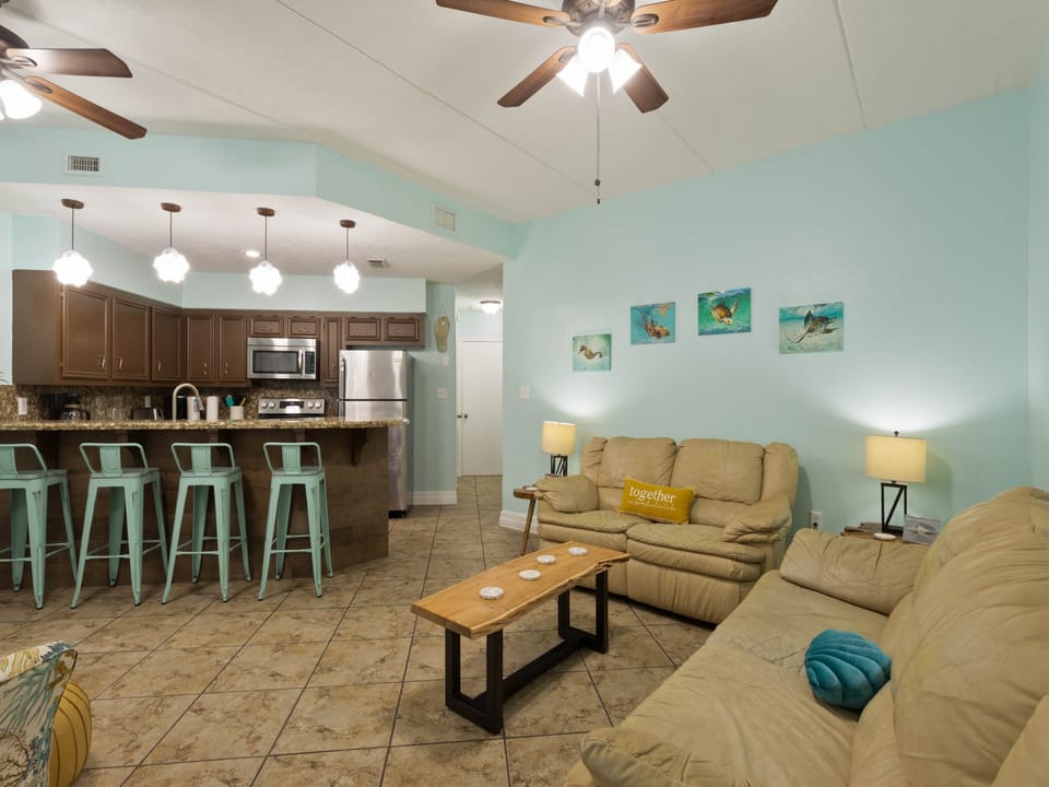 Spacious living area leading to the kitchen is perfect for dinner and movie nights!
