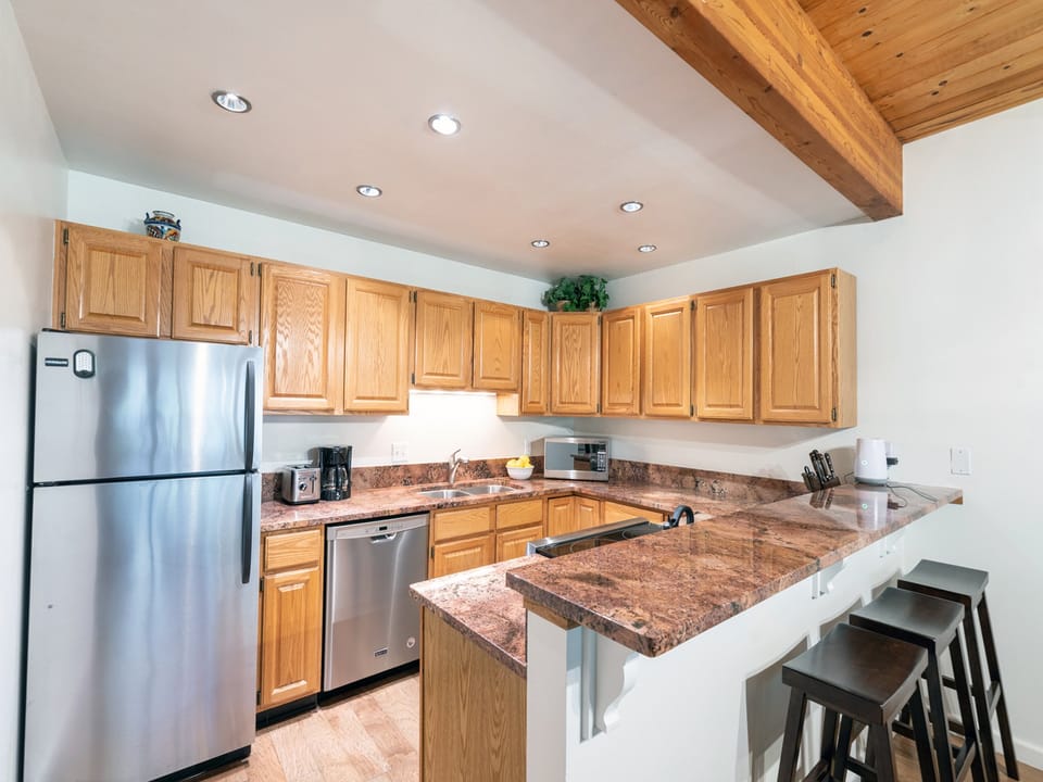 The kitchen is open plan with the living room and is well equipped for cooking family meals.