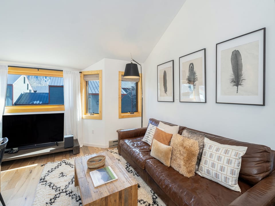 The living room enjoys uninterrupted views of Ajax peak from the living room window.