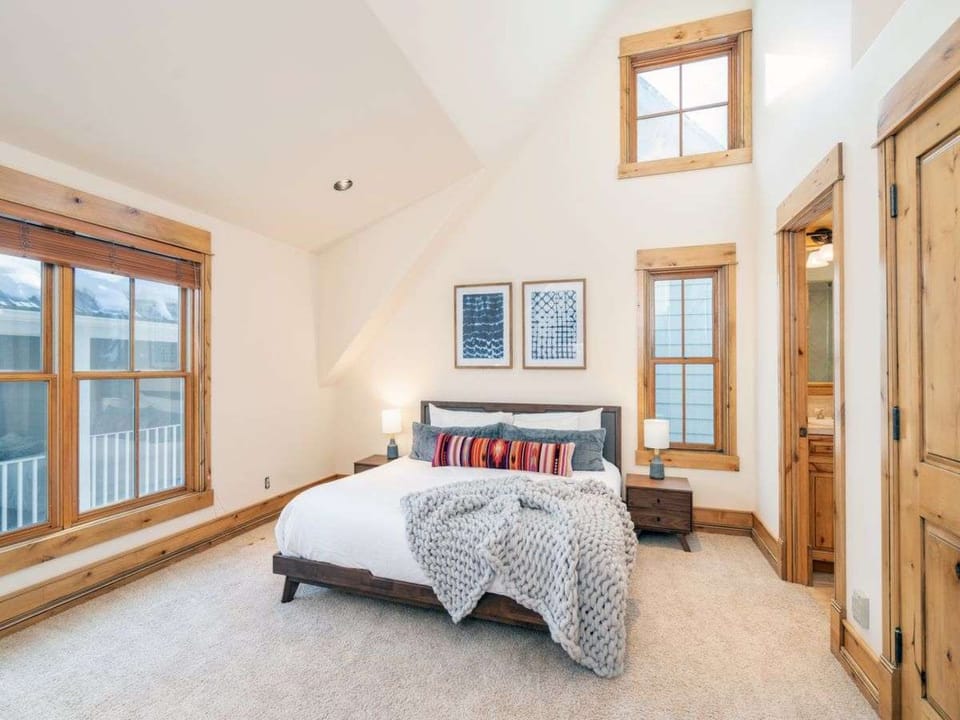 The top floor primary suite is a retreat for anyone in your party who needs a little extra quiet or space