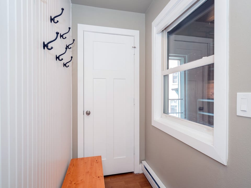Fall Line 210 - the entryway has a bench seat and hat hooks.