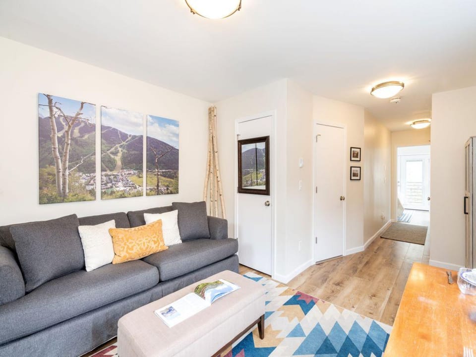 living area looking into hall that leads to river views.