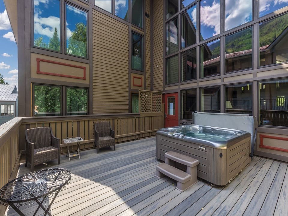 The communal hot tub is conveniently located just steps from your unit.