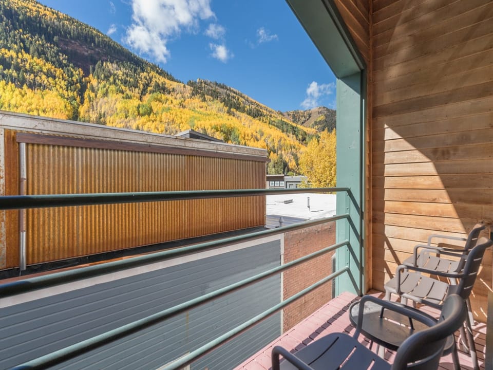 The comfortable balcony just off of the living room provides mountain views.