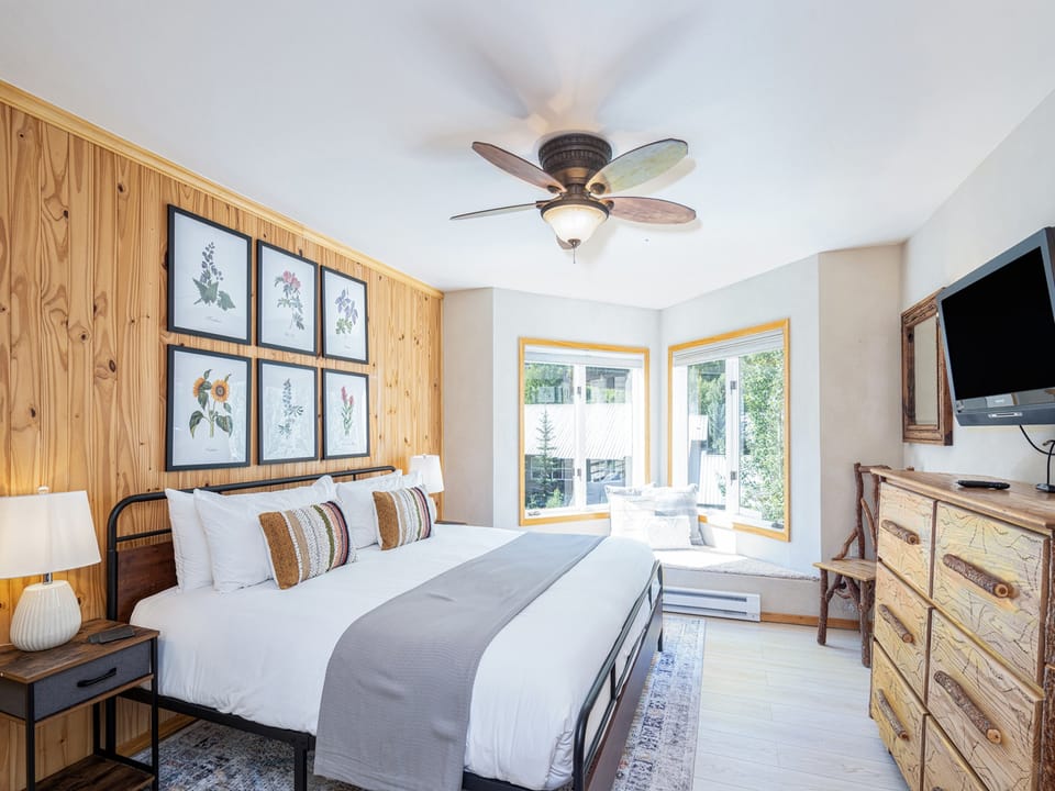 The bedroom has a King size bed with great views outside.