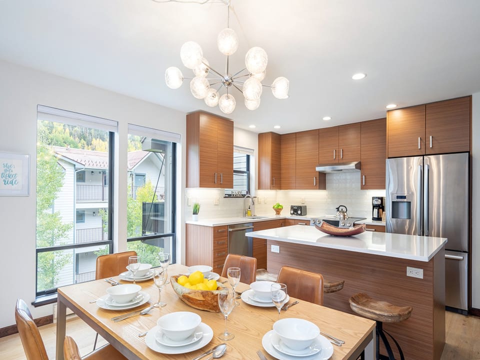 The dining area separates the kitchen and living room- seating for 6!