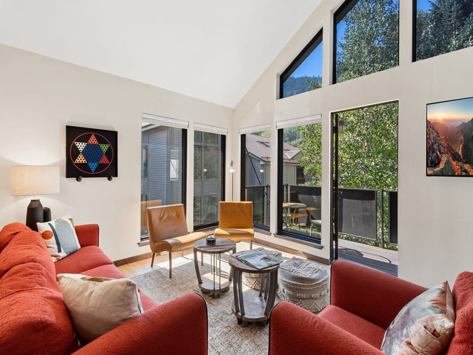 Spacious living room with mountain views and private deck.