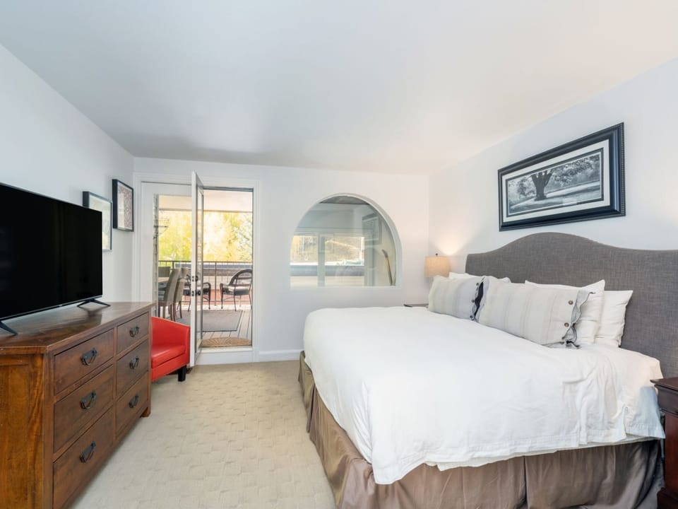 Enjoy a sunny deck with stellar views off the upstairs Primary Bedroom.