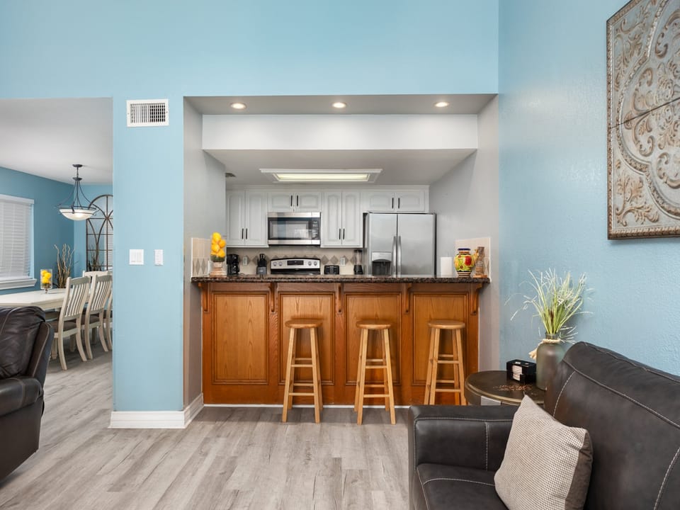 Open concept style townhome with extra bar seating in the kitchen area for 3 guests