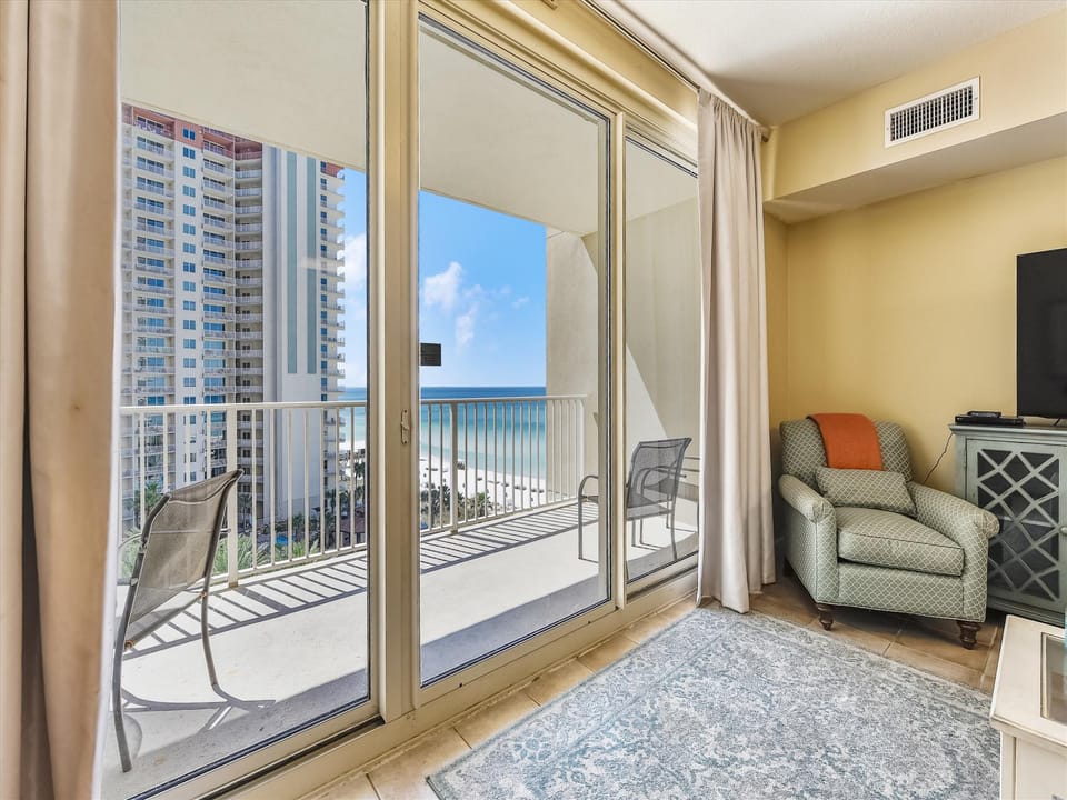 Living room with sleeper sofa and balcony access