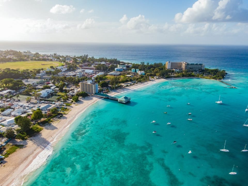 Aerial view of the beautiful Carlisle Bay nearby - go here early in the morning to see the horses swim!