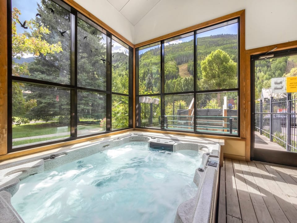 The Telluride Lodge Spa area features an indoor and outdoor 8 person hot tub for guests.  This space also features a large steam room, shower and changing room as well as restroom. open 10am-10pm