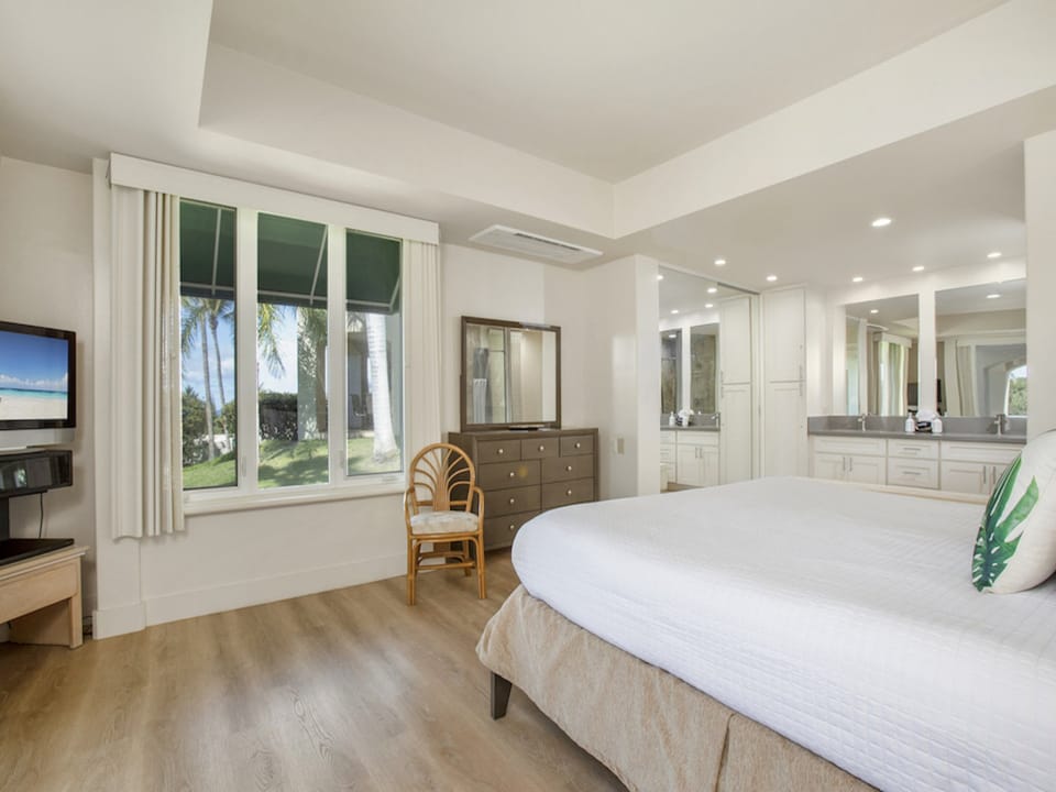 Primary bedroom has the comfort of a king size bed~ AC~ & TV