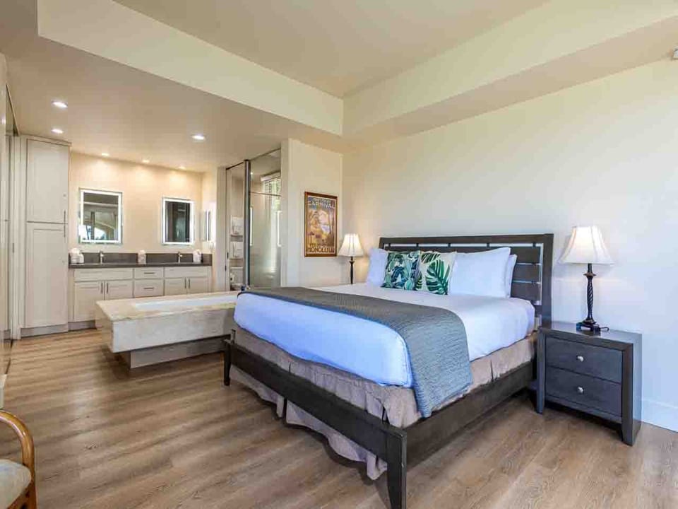Unwind in your spacious suite with a plush king bed, warm wood floors, and a spa-like ensuite bathroom just steps away—your perfect retreat after a day of adventure.