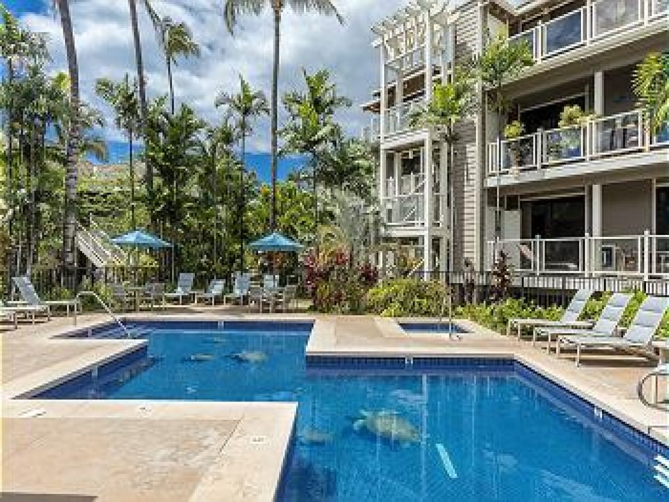 Calm waters framed by tropical landscaping