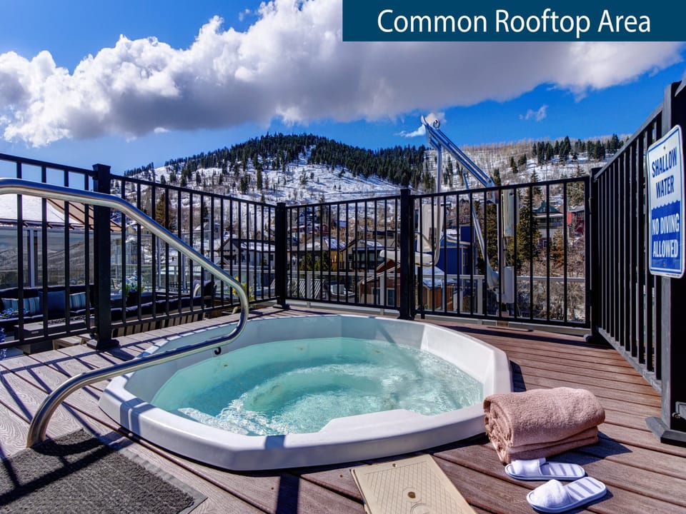 Rio Grande's Rooftop hot tub with lush green mountain views.