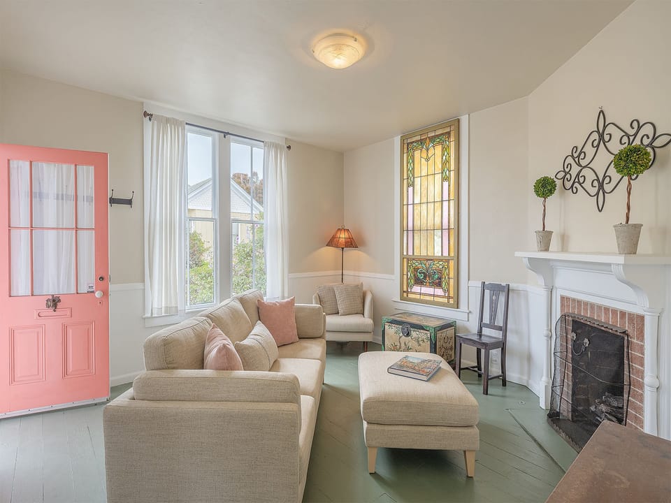 Living Room with Candle-Lit Fireplace and HDTV
