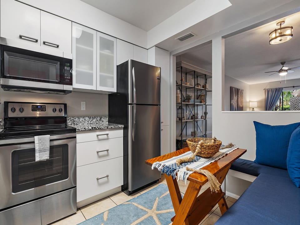 Kitchen Kitchen Kitchen with granite counters, white cabinets and stainless steel apliances.