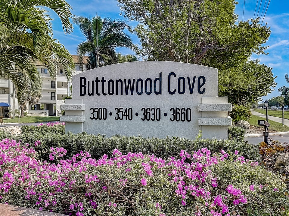 Outside of Buttonwood Cove Outside of Buttonwood Cove Buttonwood marque with building numbers.