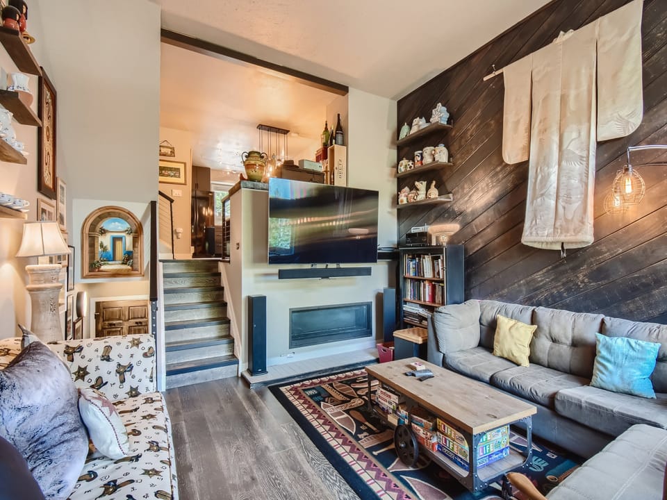 Cozy living room with fireplace and massive Smart TV!
