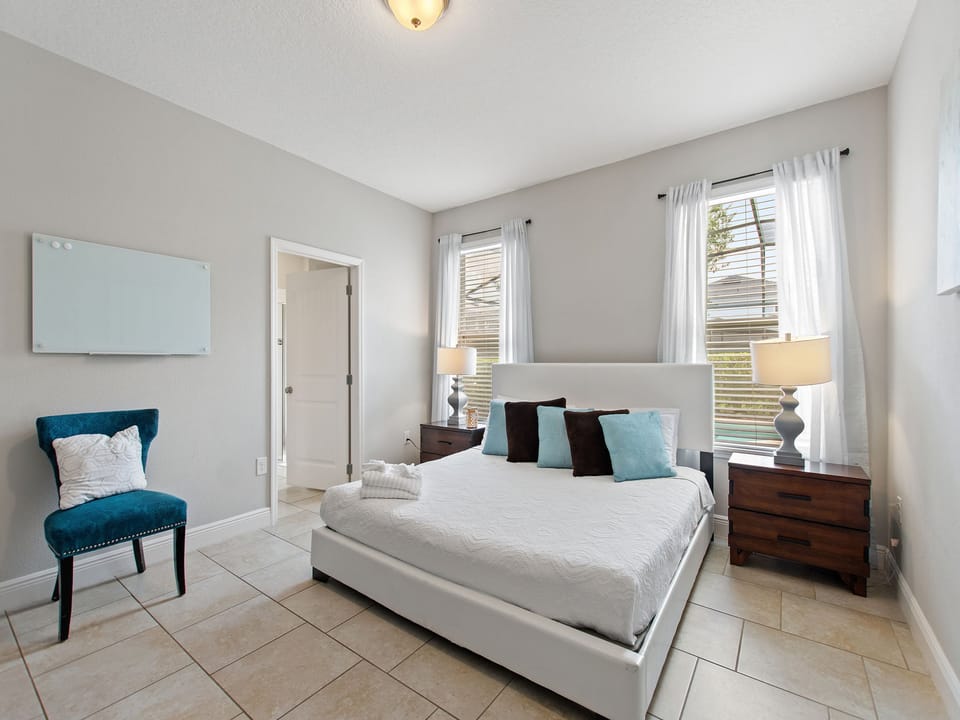 King Bedroom Suite with attached bathroom, large walk in shower dual sinks and garden tub. Direct access to pool and spa deck