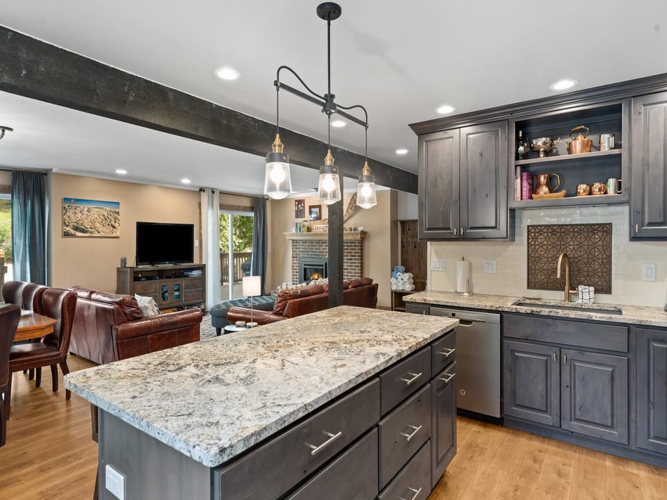 You will love cooking in this gorgeous kitchen. - Large kitchen island, grey cabinets, grey finishings.