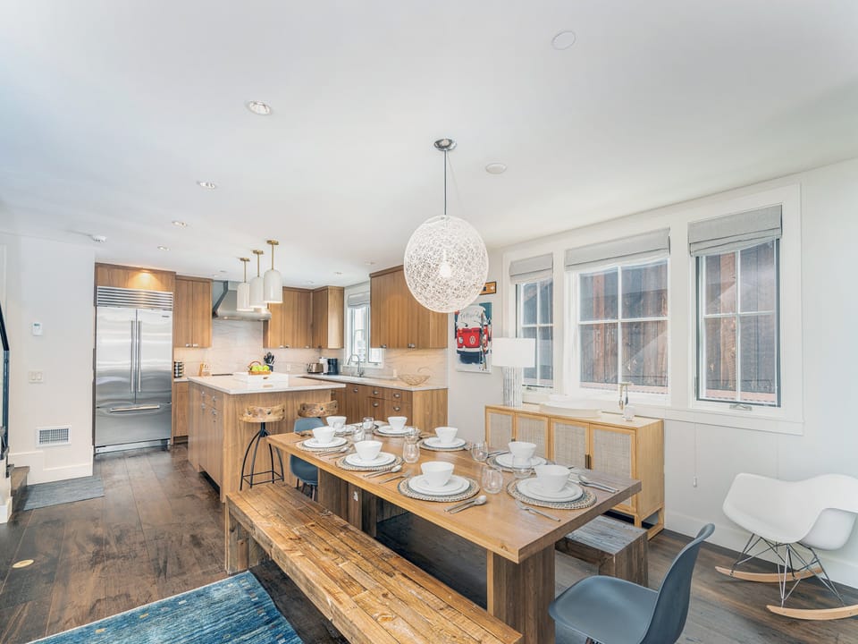 Enjoy a home or chef-cooked meal at the extra long dining table.