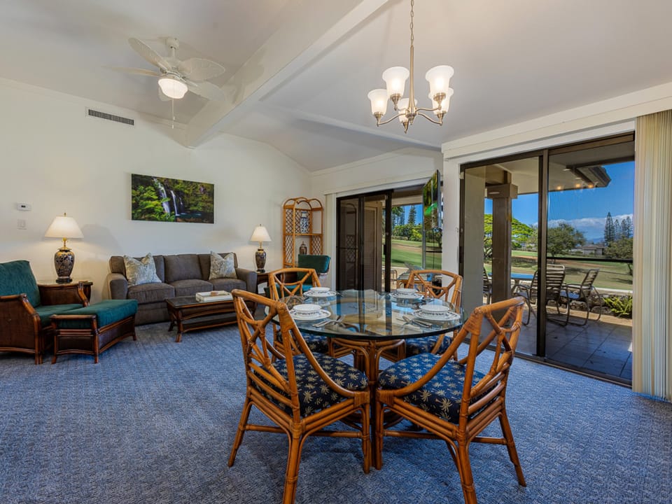Bright and spacious living room with golf course views.