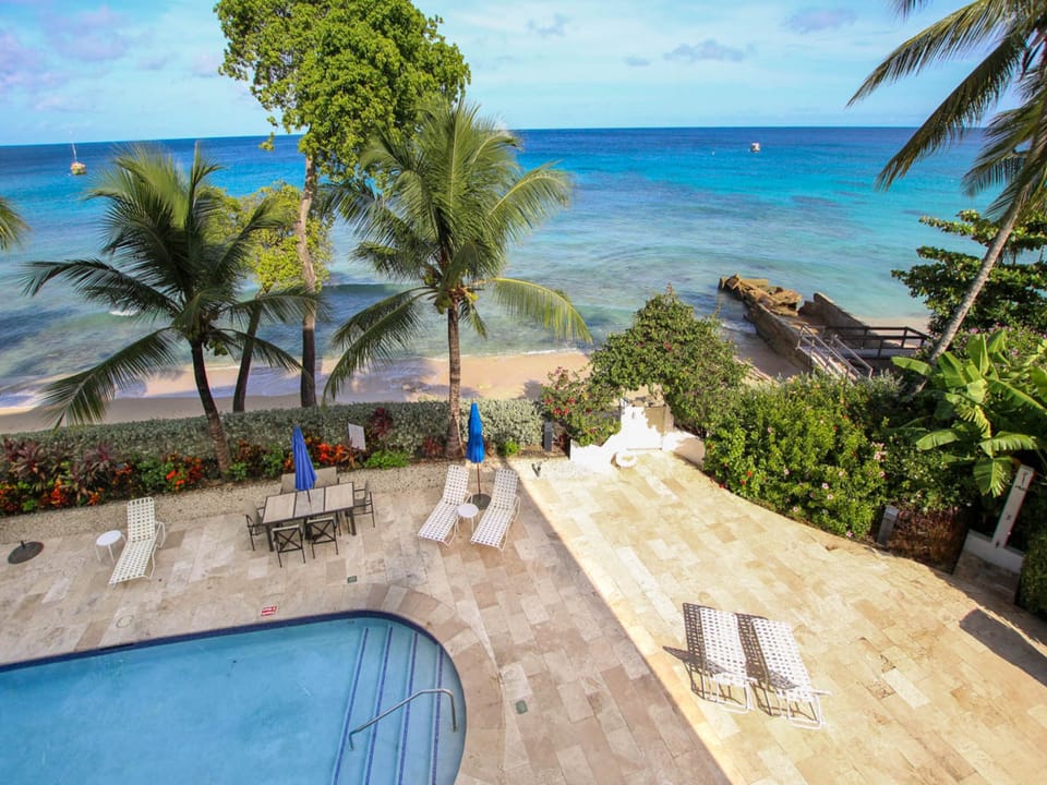 View of the pool deck and beach from your patio