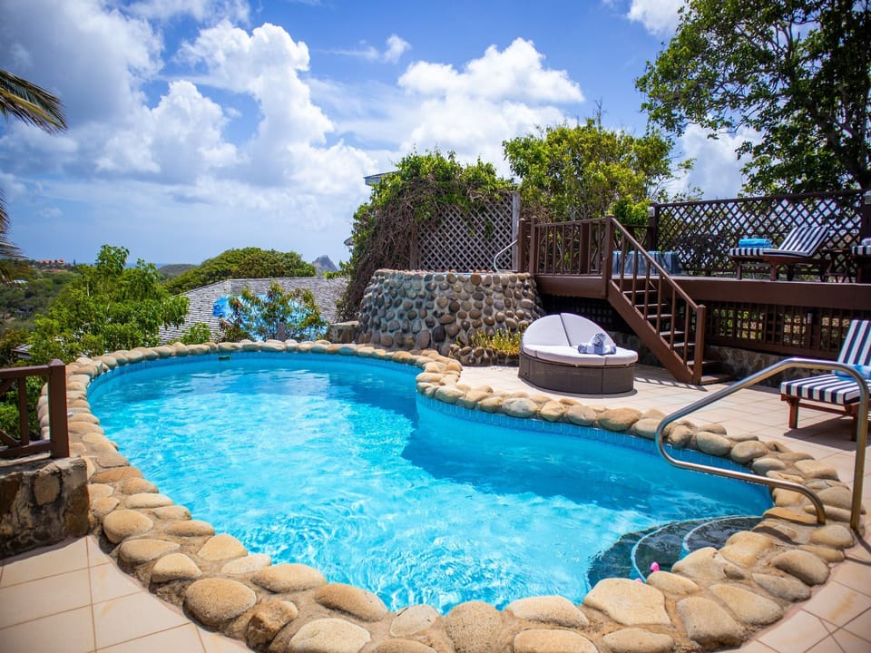 Pool with sun loungers
