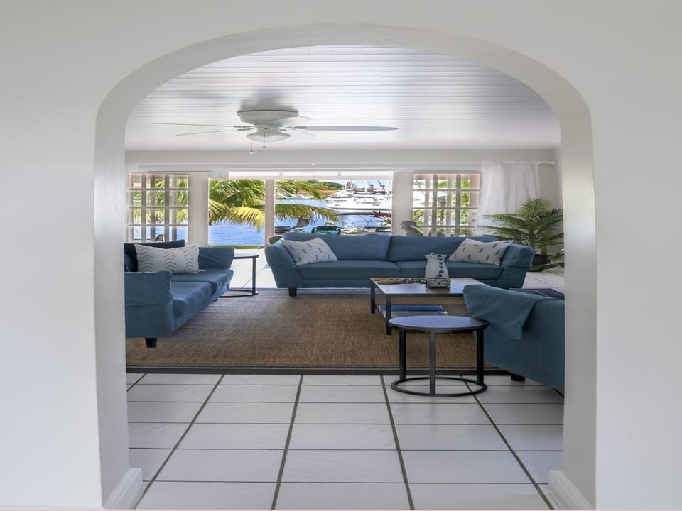 Lounge opens up to the balcony with a lovely marina view