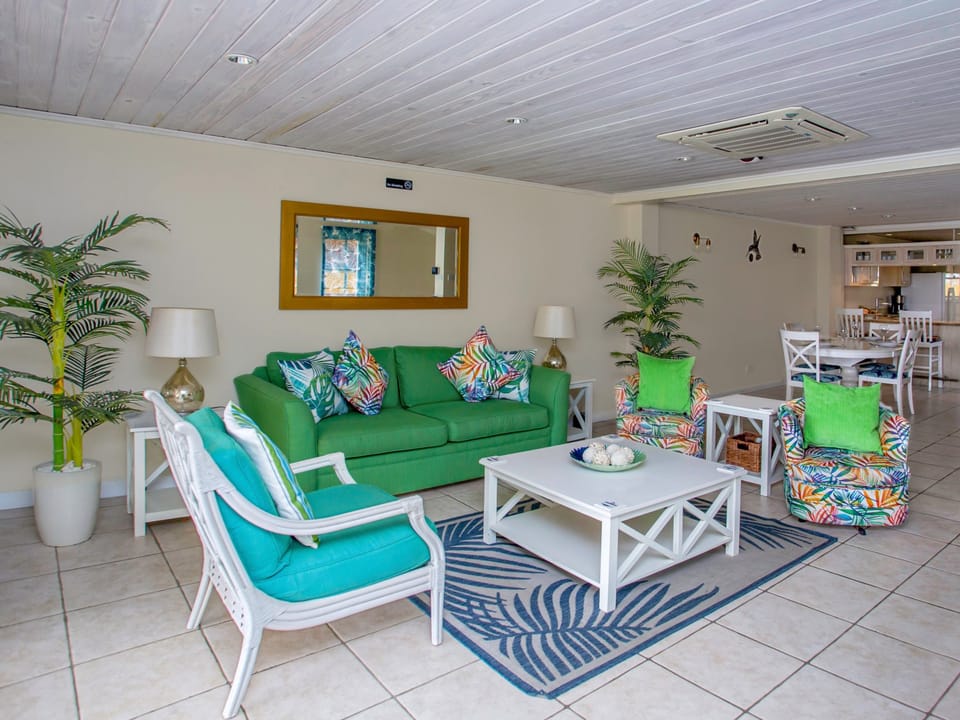 Living room with A/C, patio and smart tv