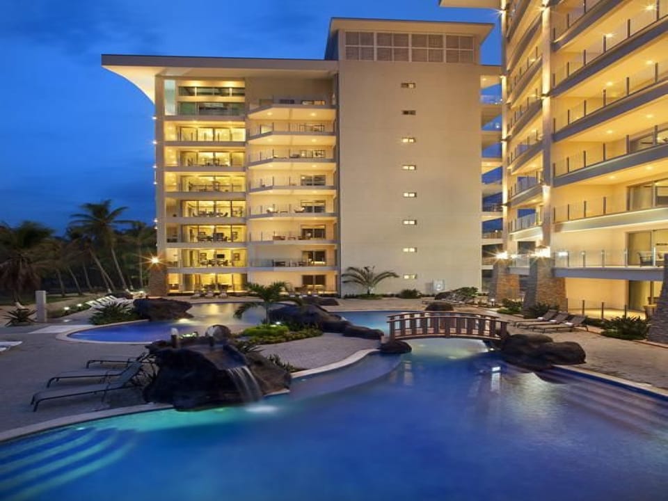 Pool and buildings at night