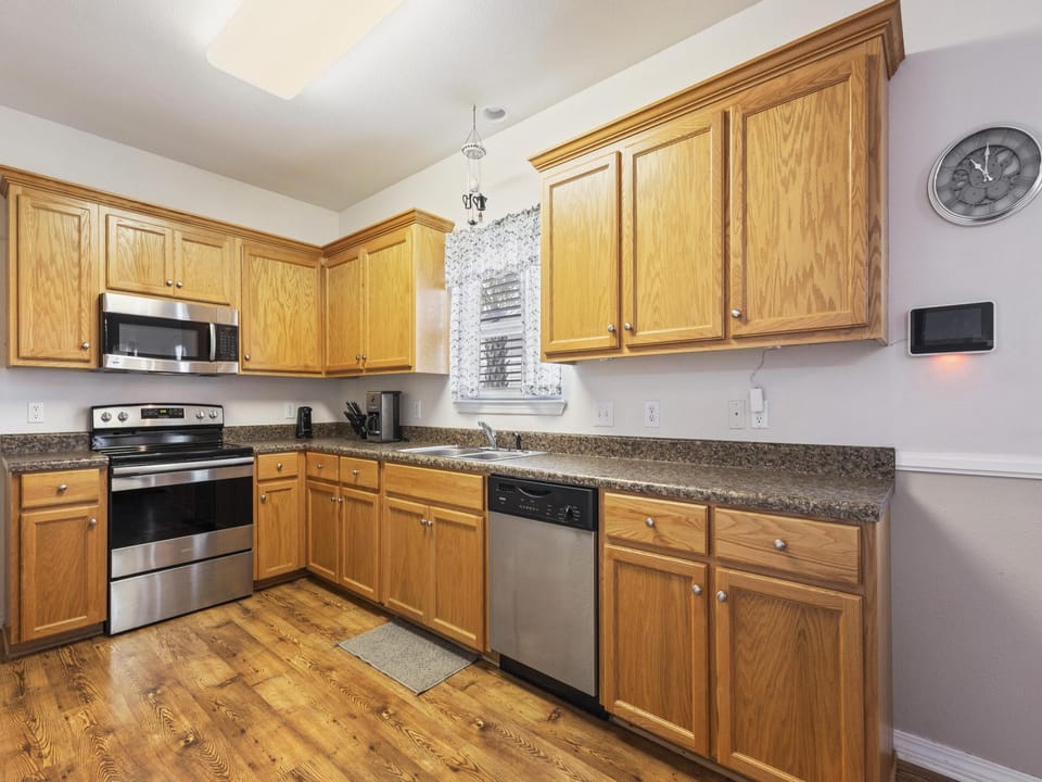 The fully stocked kitchen offers all items needed for preparing meals during your stay.