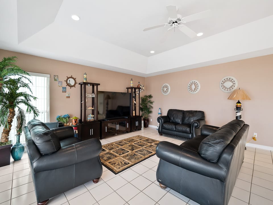 Spacious Living Area with all black leather sofas!