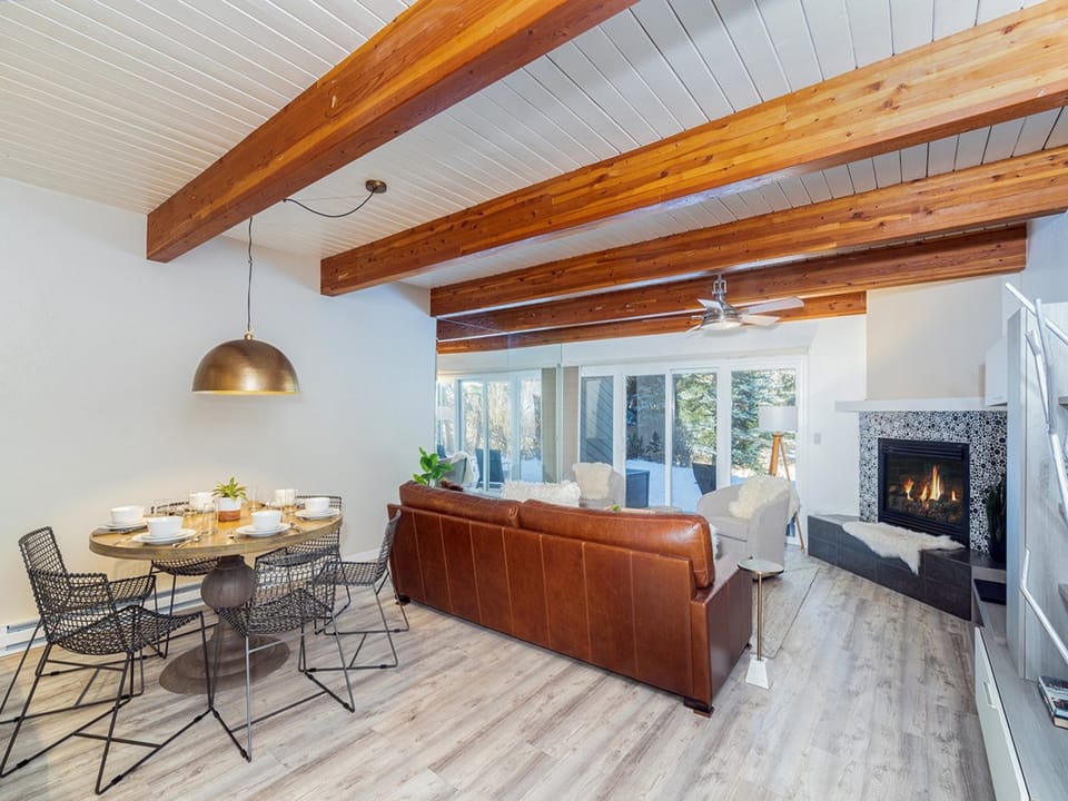 Cozy open concept family room with gas fireplace and riverfront access.