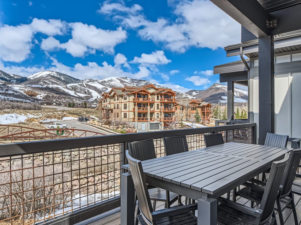 Enjoy your morning coffee at this spacious outdoor dining table while taking in the stunning mountain vistas and crisp alpine air—your private escape awaits.