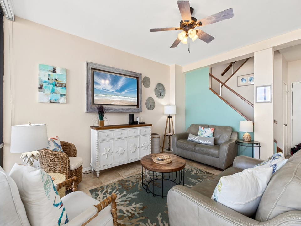 Ample seating surrounds a flat screen TV