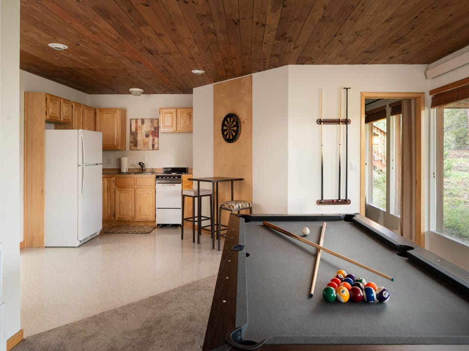 Game Room with Kitchenette Game Room with Kitchenette The pool table also turns into a ping pong table and there is a dart board