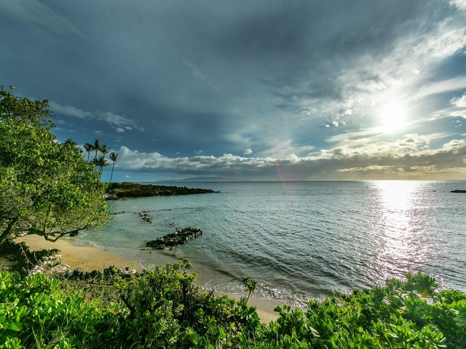 Watch Sunsets From the Beach or Your Private Lanai