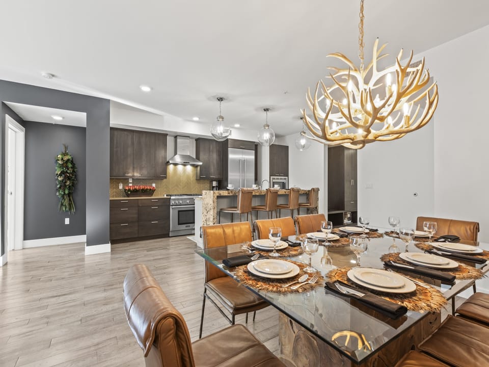 Rio Grande 203 has a stylish dining area with leather chairs and antler chandelier.