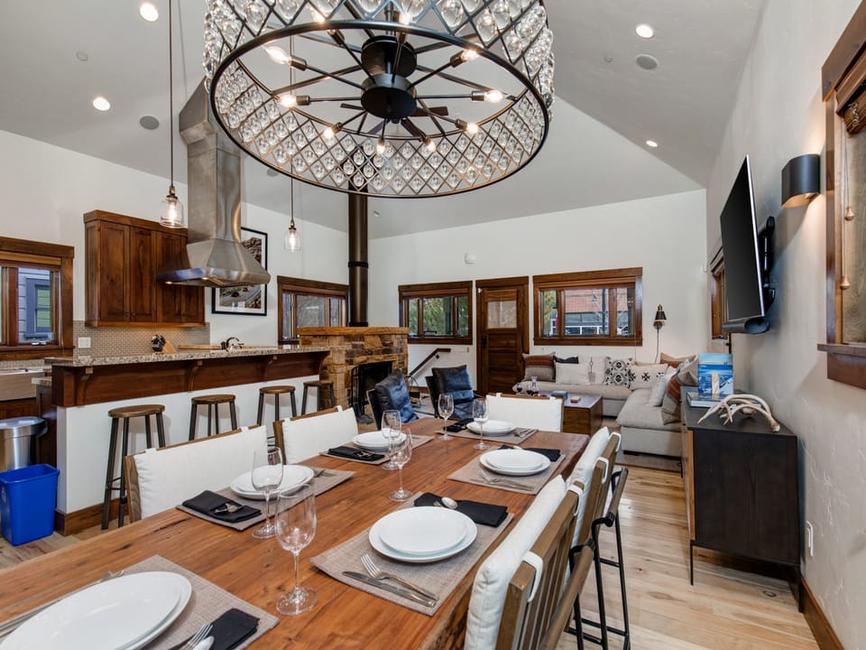 Park Villa's dining area with seating for six has a solid wood grained dining table and contemporary chairs.