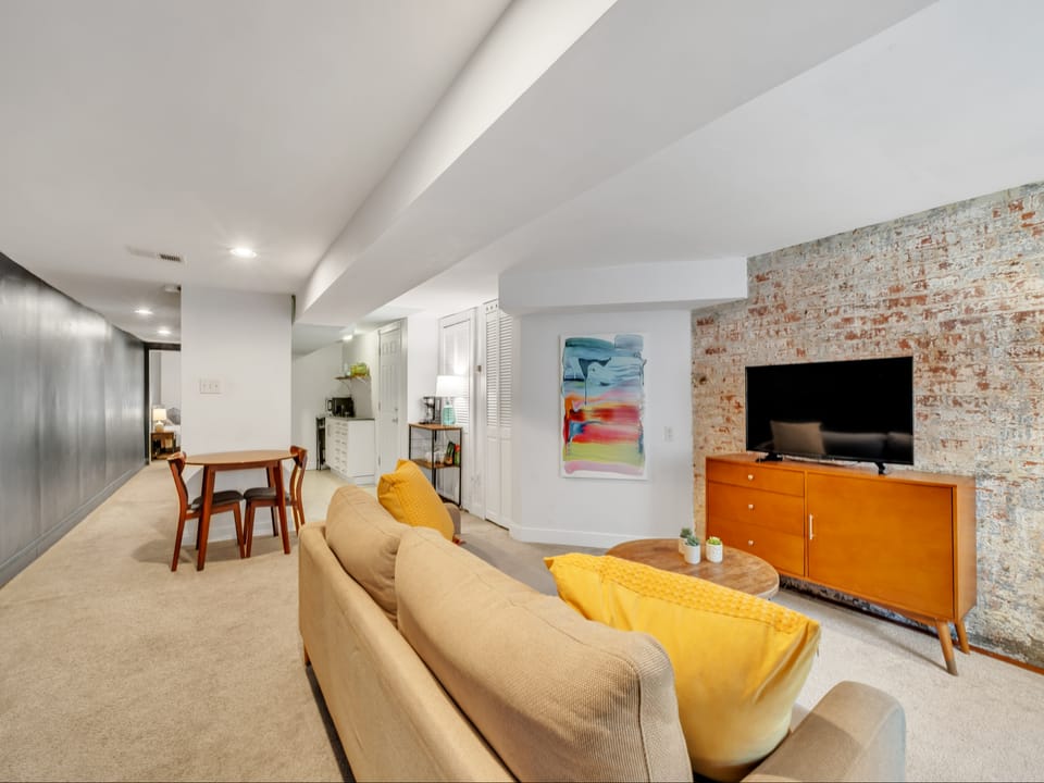 living room with couch that turns into a comfortable Queen bed