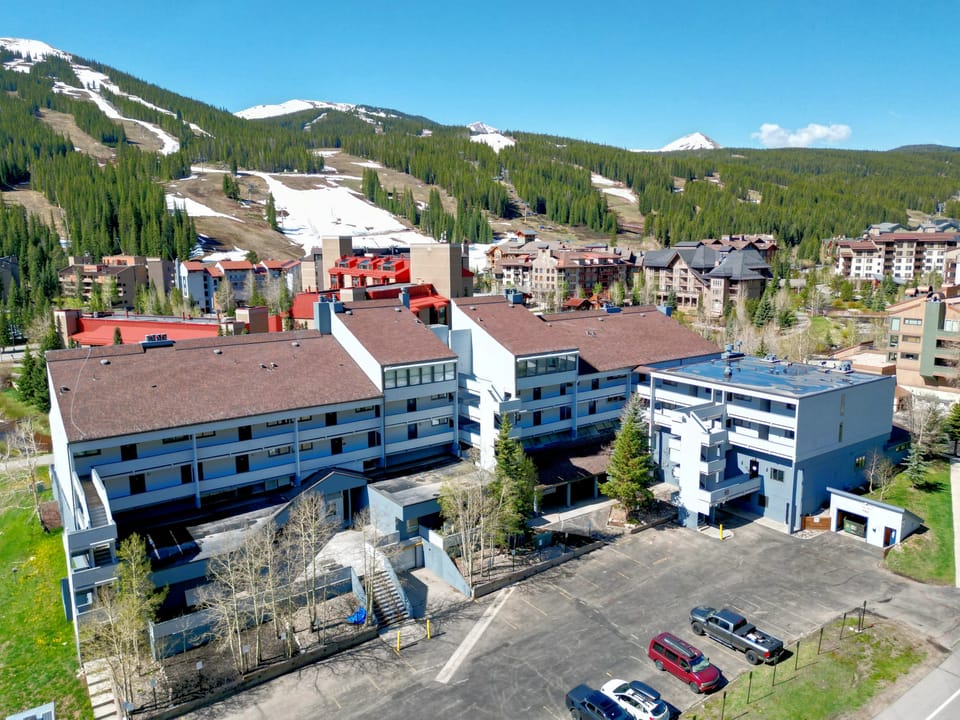 Aerial view of Snowbridge, with a beautiful mountain backdrop.