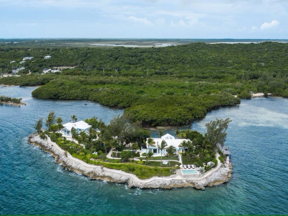 Aerial view.  Main House and pool on the right, Cottage on the left.
