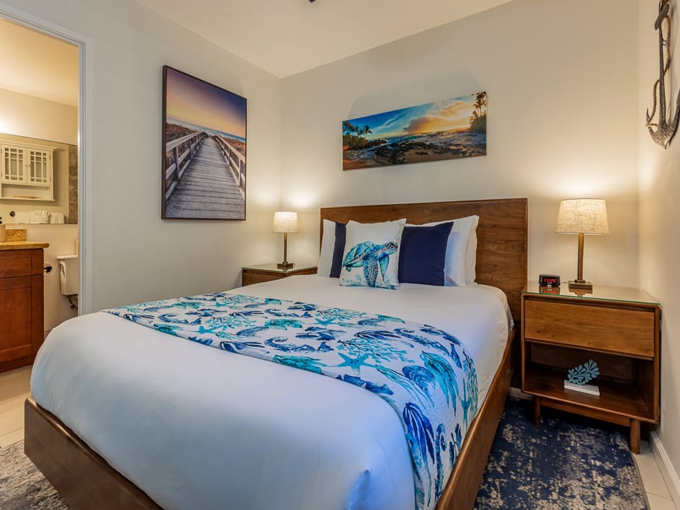 Rest peacefully in your coastal-themed bedroom with ocean artwork and crisp linens inviting sweet dreams.