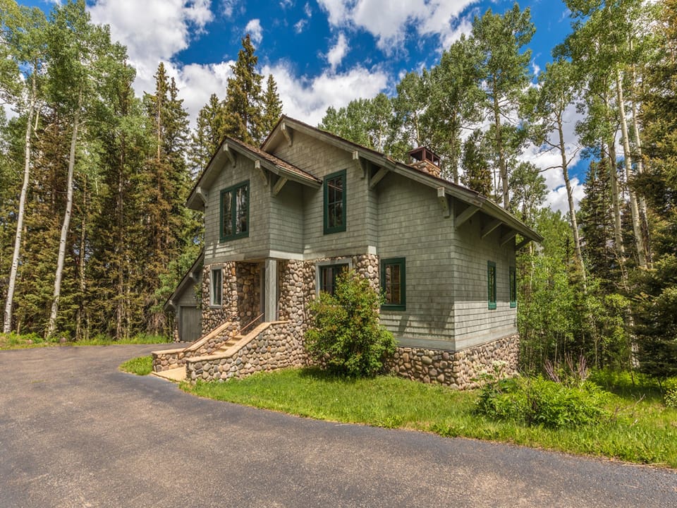 Located in a quiet neighborhood, This beautiful Mountain home features plenty of parking for a few vehicles as well as a two car garage.